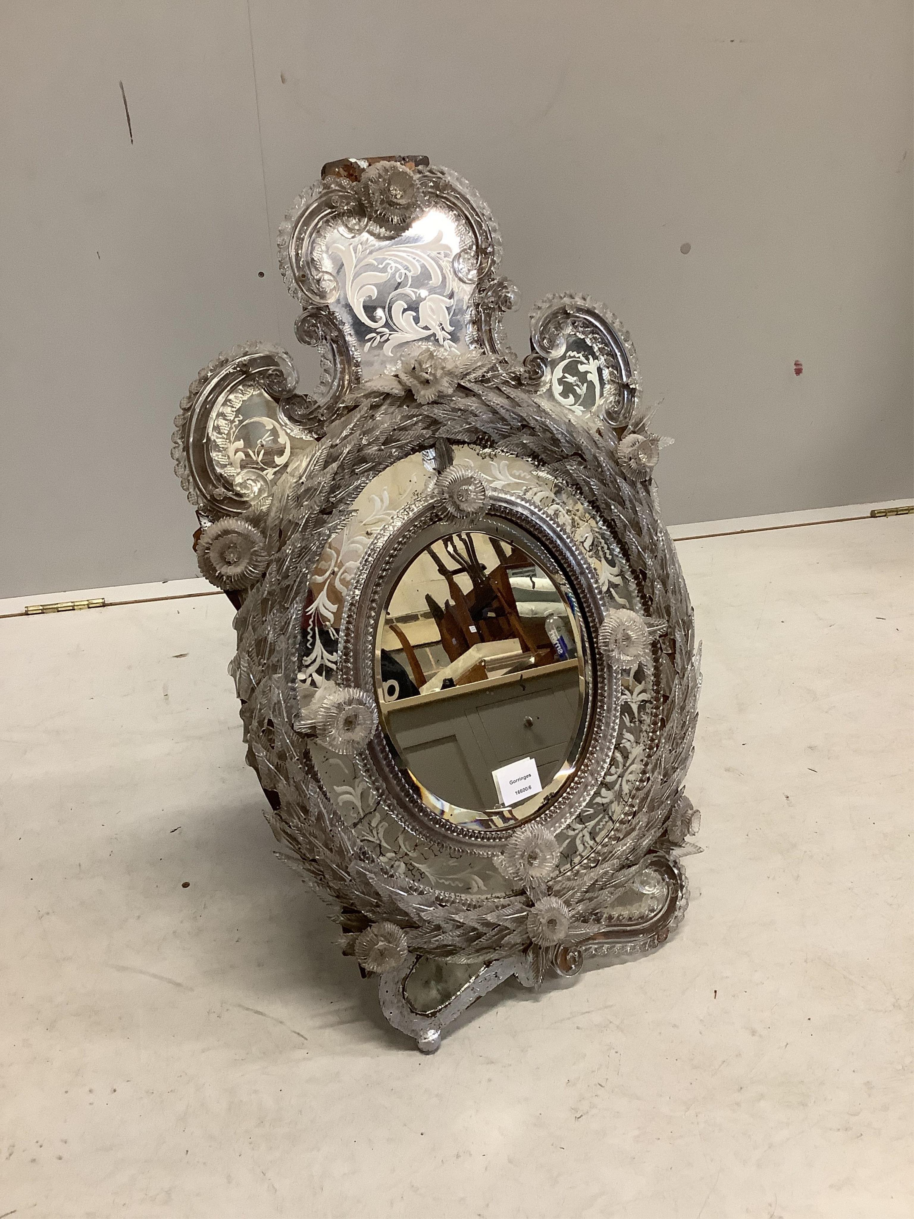 A Venetian wall mirror, width 47cm, height 74cm. Condition - poor to fair, losses to pediment and lower left side